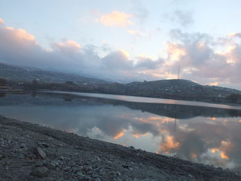 Scenic view of lake against sky during sunset