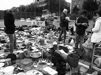 People at market stall in city