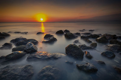 Scenic view of sea against sky during sunset