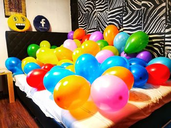 High angle view of multi colored balloons on table