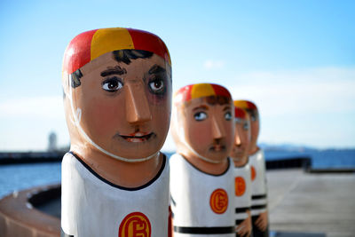 Close-up of toys toy against sky