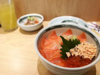 Close-up of salad in bowl on wooden table