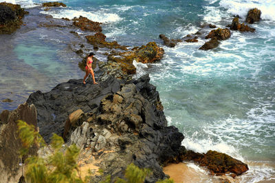 High angle view of woman standing on beach