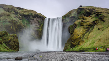 Scenic view of beautiful waterfall from cliff