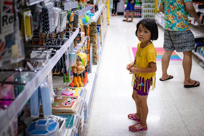 Women standing on display at store