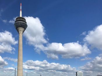 Low angle view of building against cloudy sky