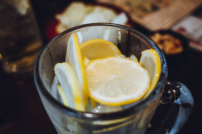 Close-up of lemon slice in drinking glass