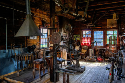 Empty chairs and tables in building