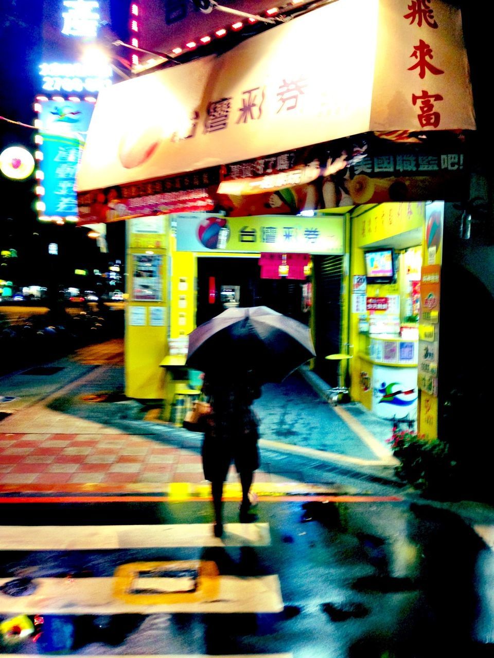 illuminated, night, text, street, lifestyles, western script, store, city, full length, walking, architecture, building exterior, built structure, city life, men, communication, non-western script, person