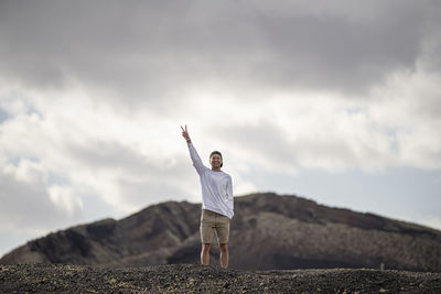 Full length of man standing on mountain