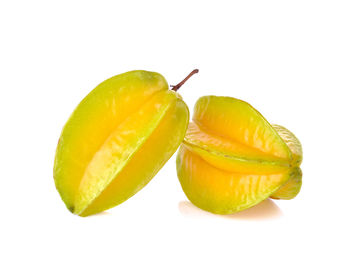 Close-up of fruits against white background