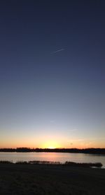 Scenic view of sea against sky at sunset