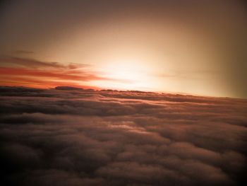 Scenic view of landscape against sky at sunset