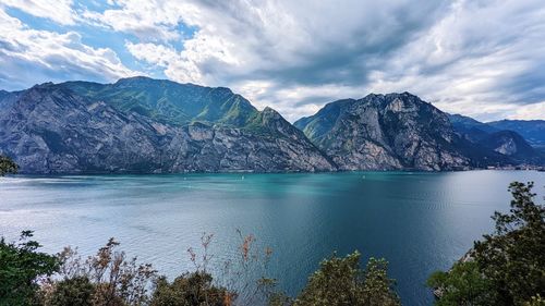 Scenic view of lake and mountains against sky