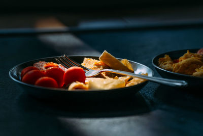 Breakfast on plate lit by the morning sun