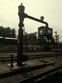 Train in factory against clear sky