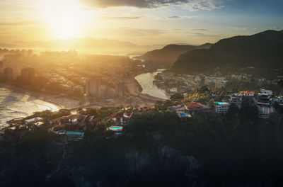 High angle view of city at sunset