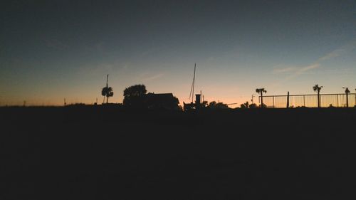 Silhouette tower against sky during sunset