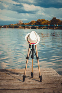 Pier over lake against sky