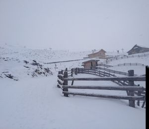 Scenic view of snow covered landscape against clear sky