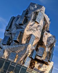 Low angle view of building against blue sky