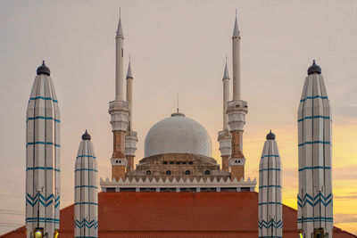 Panoramic view of buildings in city against sky