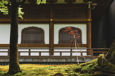 Empty benches against building