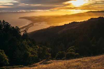 Scenic view of landscape against sky during sunset