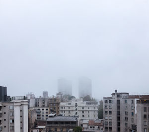 Buildings in city against sky