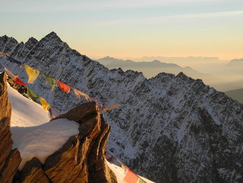 Scenic view of snow covered mountains against sky