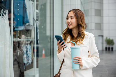 Young woman using mobile phone