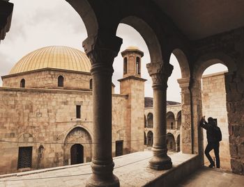 People walking in historic building