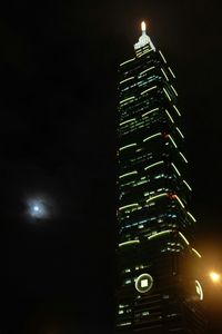 Low angle view of illuminated lights at night