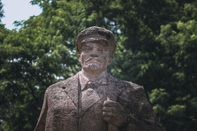 Close-up of statue against trees