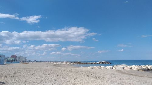 Scenic view of beach against sky