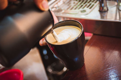 High angle view of coffee cup on table