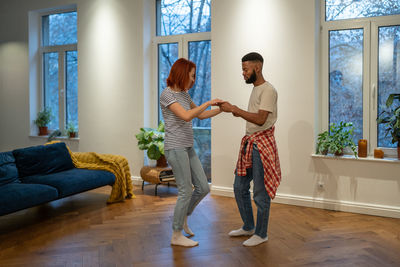 Full length of woman standing at home