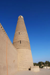 Low angle view of building against blue sky