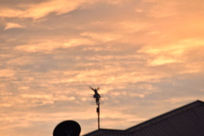 Low angle view of cloudy sky at sunset