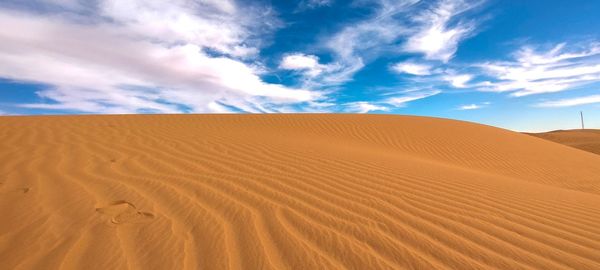 Scenic view of desert against sky