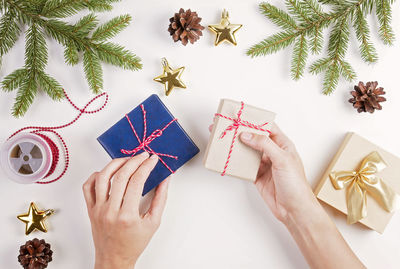 Close-up of woman holding gift boxes