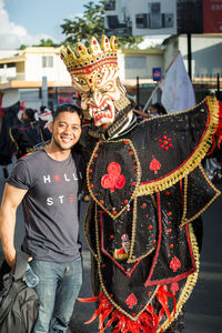 Midsection of woman standing in city