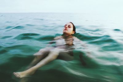 Woman swimming in pool