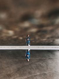 Full length of young man standing against the sky