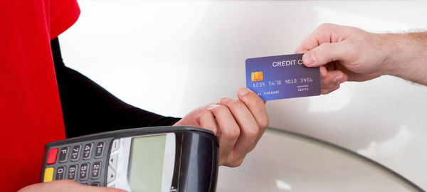 Close-up of hands holding camera