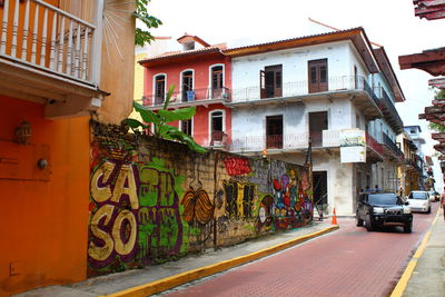 Street by multi colored residential buildings