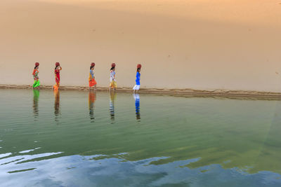 View of men fishing in the lake