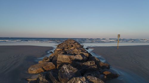 Scenic view of sea against clear blue sky