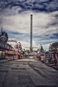 Ferris wheel in city against sky