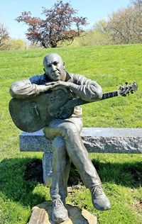 Statue on field in park